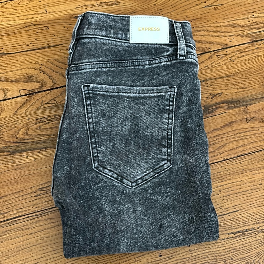 Gray waged raw hem mid rise express jeans